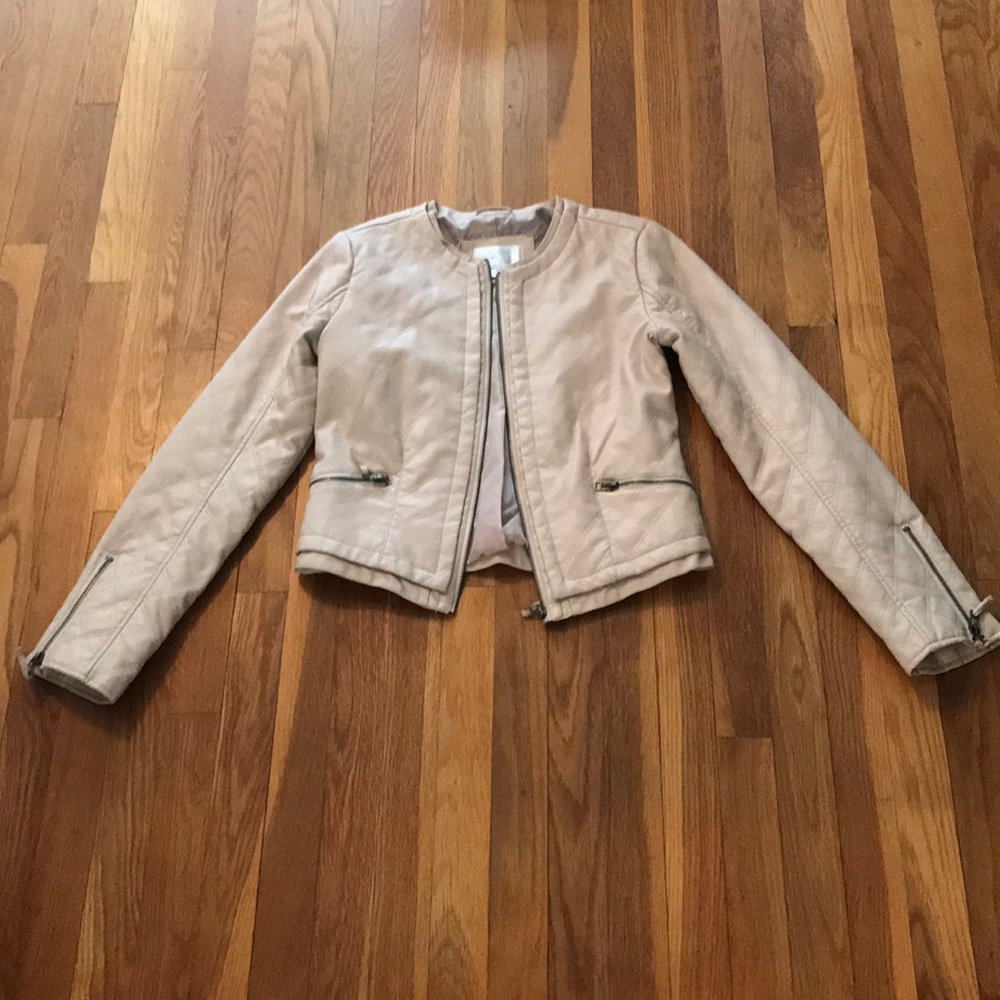 Cream faux leather jacket with zippers on sleeves